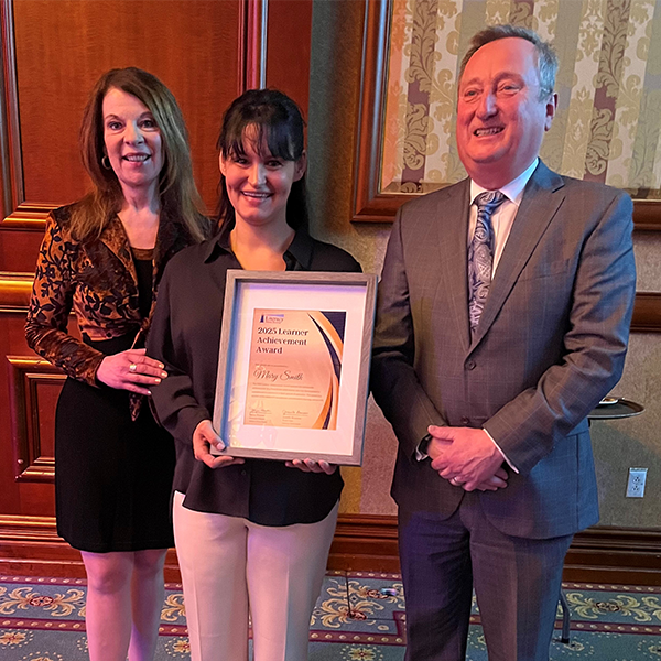 Glenn Copeland to the right of one of the adult learners