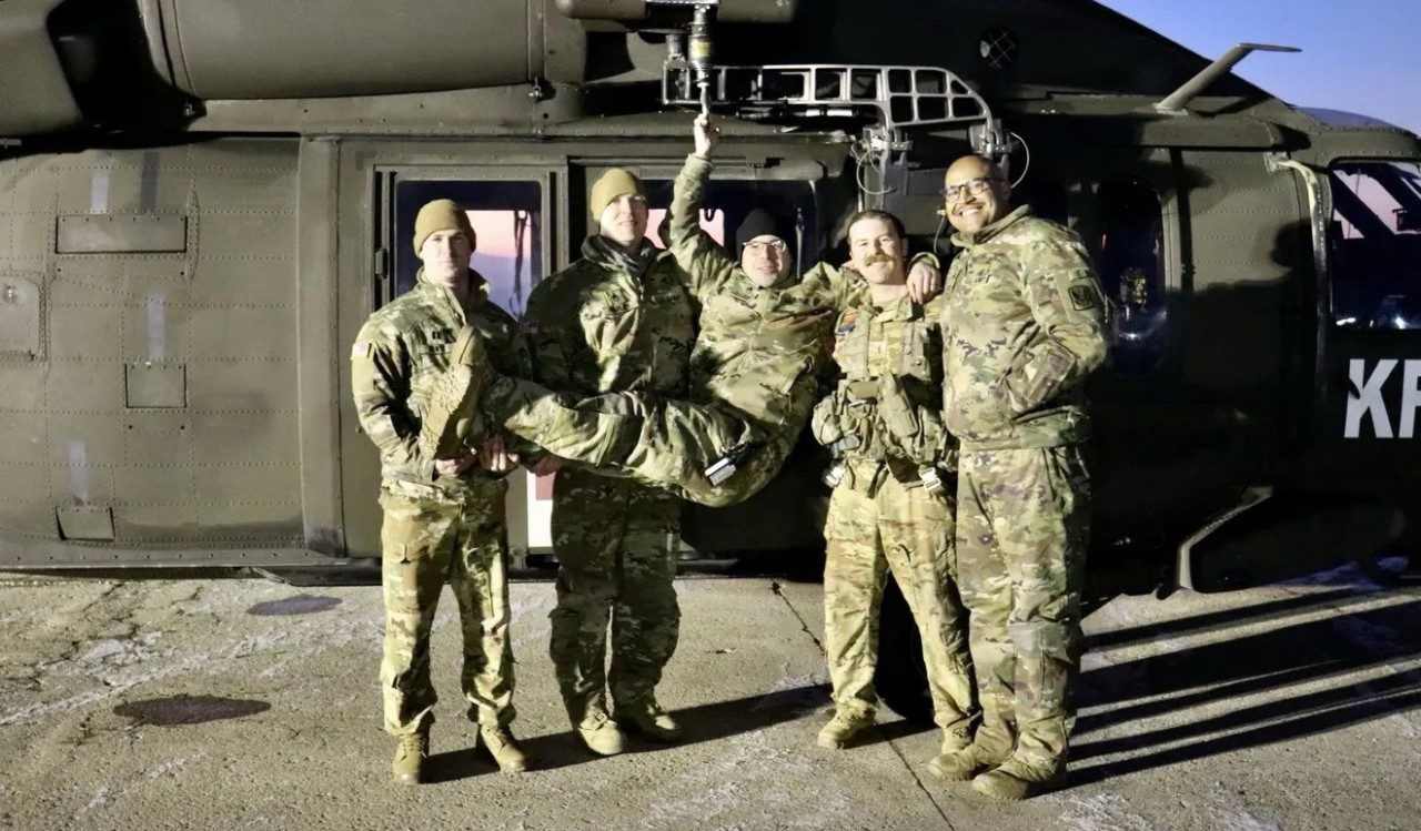 The Kosovo Force 1st up Medevac crew celebrates a successful medevac operation. From left to right, Capt. Mark Dente, Staff Sgt. Ryan Farley, Staff Sgt. Matthew Medeiros, Chief Warrant Officer 3 Joshua Mason, and Sgt. Brandon Bessette (Photo courtesy Rhode Island National Guard).